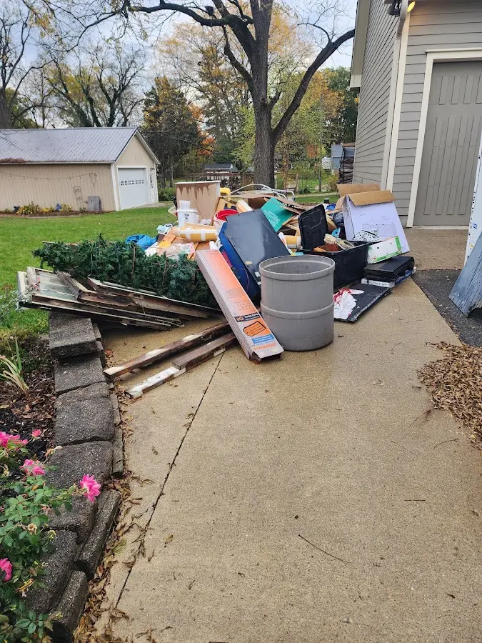 Dumpster being loaded with debris for Residential Dumpster Rental in Carlstadt